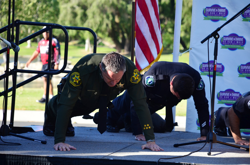 Orange County Under Sheriff Don  Barnes participates in a push up challenge during the 2016 Survive & Thrive 5K Rn/Walk (Photo courtesy of Patricia Wenskunas)