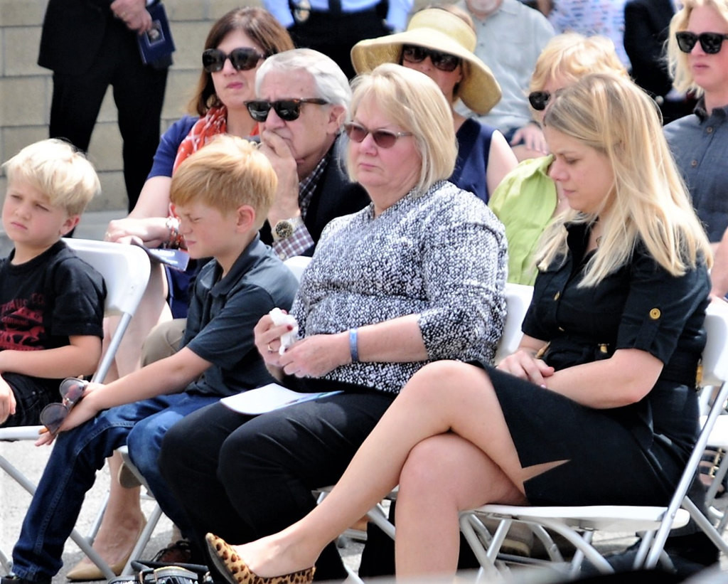 Officer James David Ketchum’s daughter, Hilary Ketchum-Bos, from right, wife, Meg Ketchum, and grandsons David Bos, 9, and Jasper Bos, 7, attended a memorial at Costa Mesa Police headquarters  Friday honoring Ketchum and Officer John “Mike” Libolt, who were both killed March 10, 1987, when their helicopter collided with a Newport Beach helicopter.