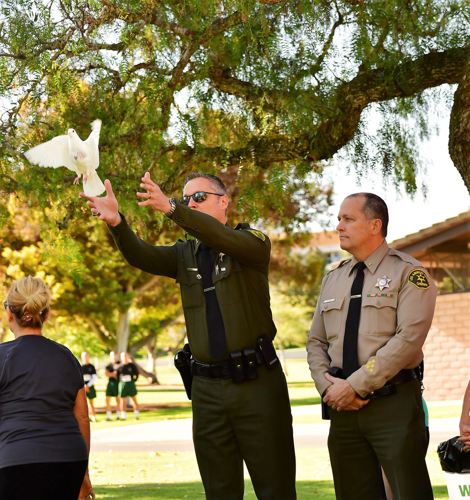 Orange County Under Sheriff Don Barnes releases a dove in honor of survivors of violent crimes during the 2016 Survive & Thrive 5K Run/Walk. (Photo courtesy of Patricia Wenskunas)