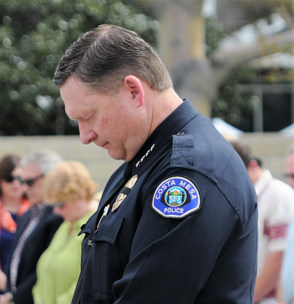 Costa Mesa Police Chief Rob Sharpnack bows his head during a memorial service Friday at the Costa Mesa Police Station commemorating the 30th anniversary of the March 10, 1987 on-duty deaths of officers Mike Libolt and Dave Ketchum.