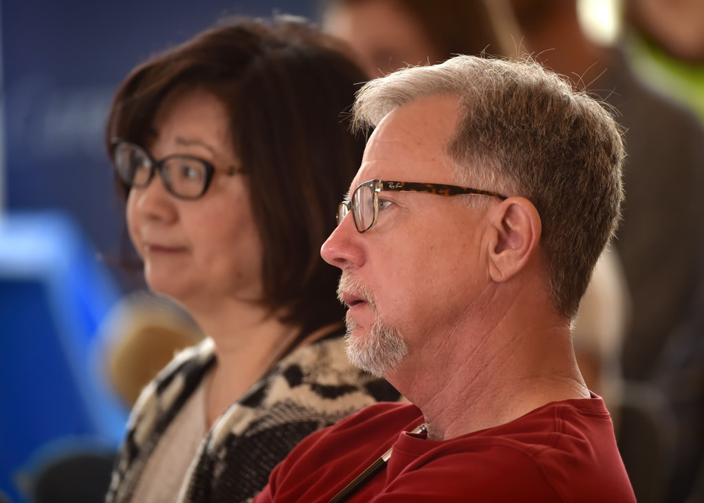 Peter Bares of Santa Ana listens to the Homeless 101 talk with his wife, Donna, behind him. Photo by Steven Georges/Behind the Badge OC