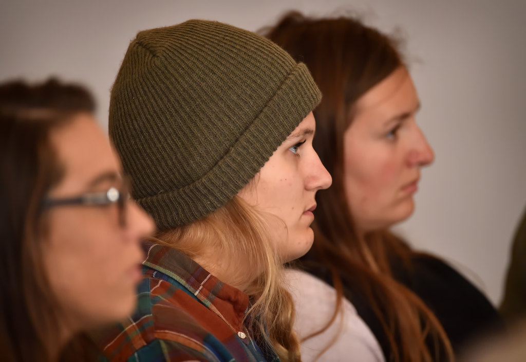 Kolle Smith of Fullerton, center, listens to the Homeless 101 talk. Photo by Steven Georges/Behind the Badge OC