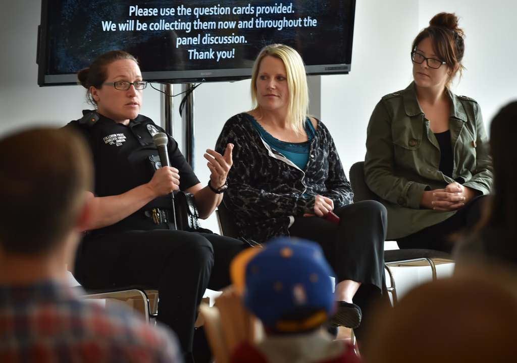 Fullerton PD Homeless Liaison Officer, Cpl. Ginny Johnson, left, Carrie De Laurie of St. Jude Medical Center, and Ariel Yarrish of Future in Humanity hold a panel discussion as they take questions during Fullerton ACTÕs Homeless 101 seminar. Photo by Steven Georges/Behind the Badge OC