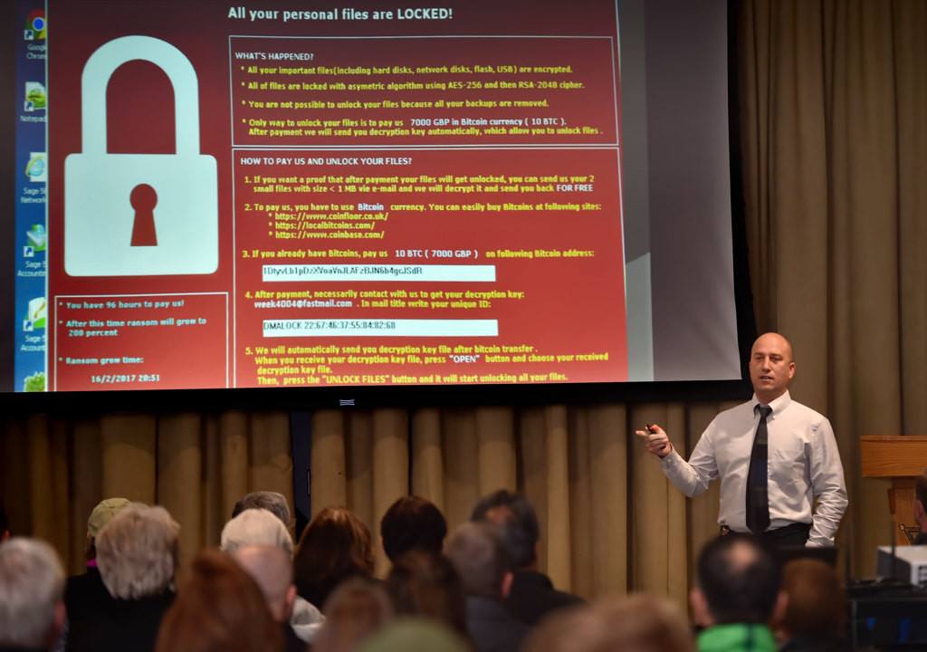 OCSD Investigator Adam Sandler talks about how hackers can hold you hostage, locking you out of your personal and business data, during a Citizens’ Academy presentation on Cyber Crimes. Photo by Steven Georges/Behind the Badge OC