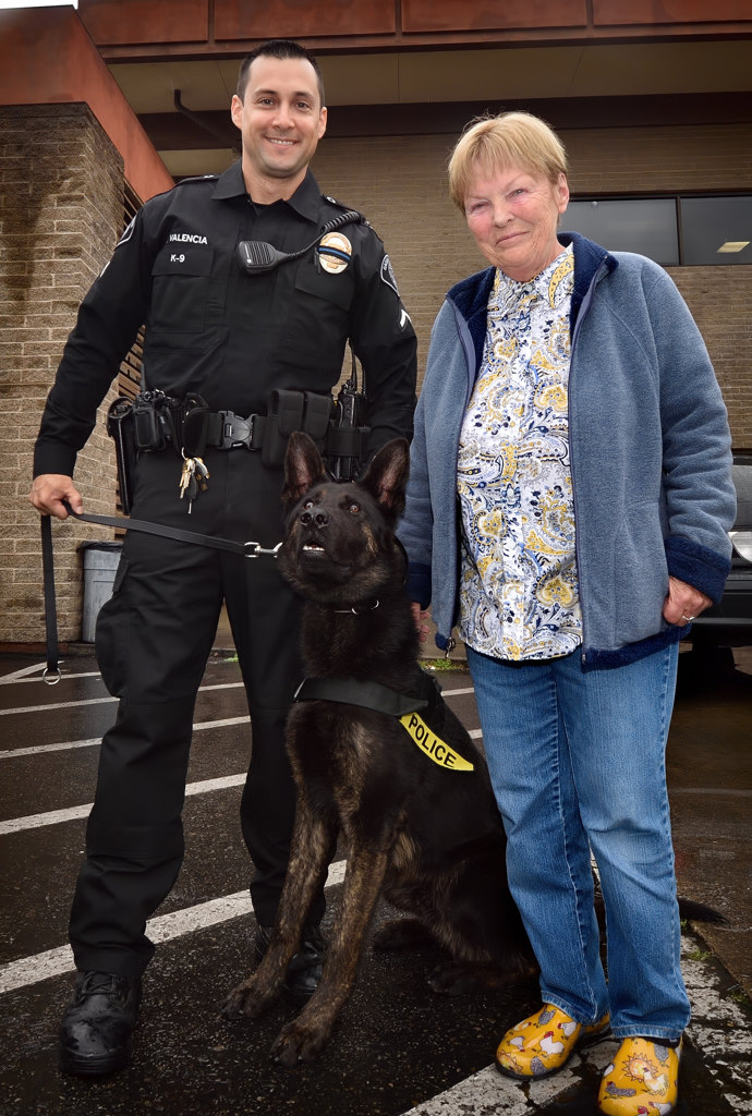 Vader, Garden Grove PD’s new K-9, with Master Officer Edgar Valencia and Kay Parcell, who generously donated the money used to purchase the new K-9 for the GGPD. Photo by Steven Georges/Behind the Badge OC