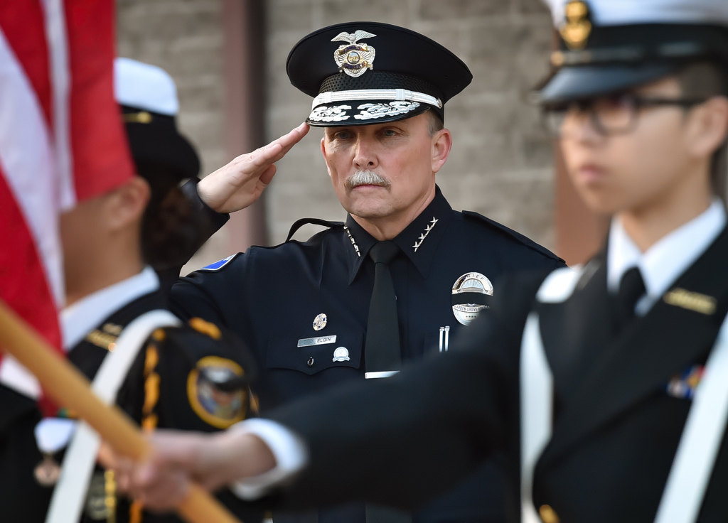 Garden Grove Police Chief Todd Elgin salutes at the start of a prayer vigil for Whittier PD Officer Keith Boyer at GGPD. Photo by Steven Georges/Behind the Badge OC