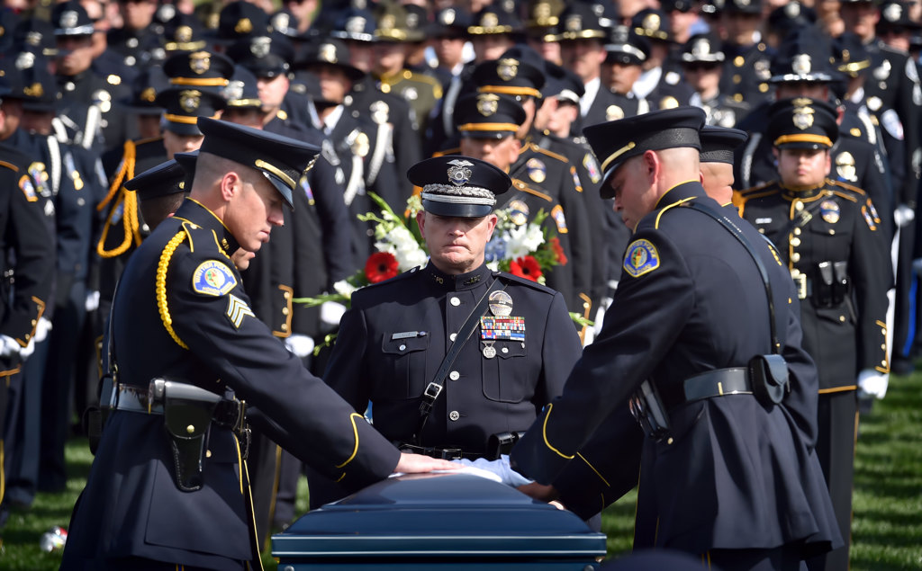 Whittier and LAPD honor guards place their white gloves on the casket of ittier PD Officer Keith Boyer at Rose Hills Memorial Park. Photo by Steven Georges/Behind the Badge OC