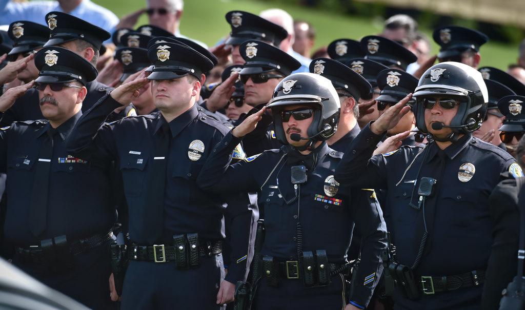 Whittier PD Officers salute during the playing of Taps at Rose Hills Memorial Park for Whittier PD Officer Keith Boyer. Photo by Steven Georges/Behind the Badge OC