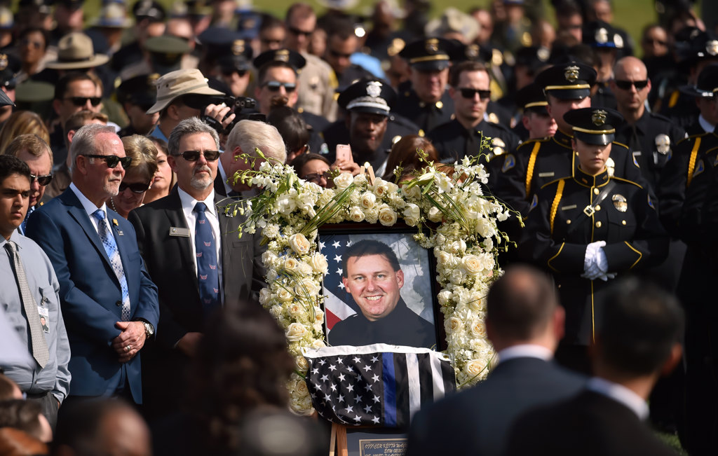 A photo of Whittier PD Officer Keith Boyer is present during his funeral ceremony at Rose Hills Memorial Park. Photo by Steven Georges/Behind the Badge OC