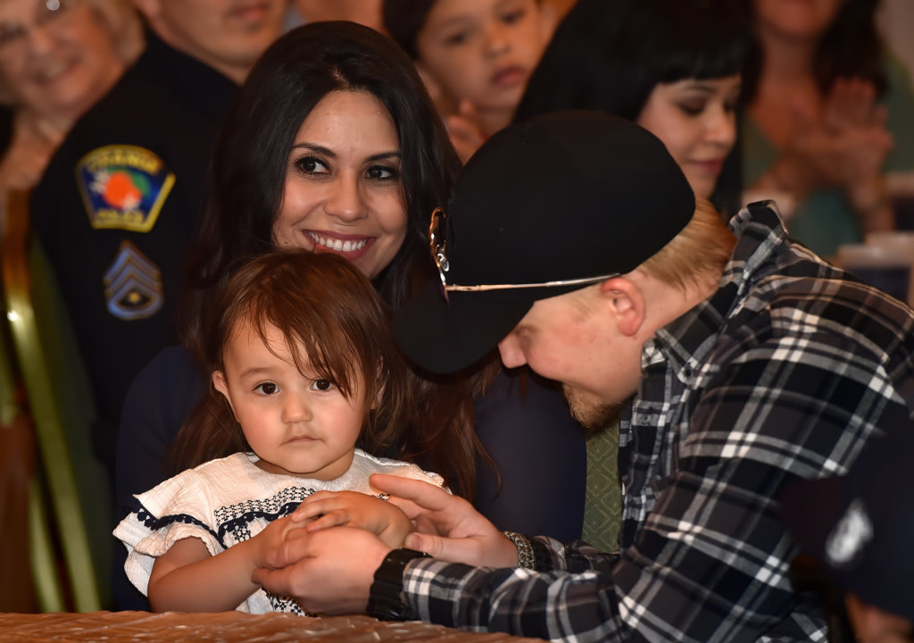 Orange PD Officer Sharif Muzayen with his wife Vanessa Muzayen and their daughter Leia at the Orange PD awards ceremony. Photo by Steven Georges/Behind the Badge OC