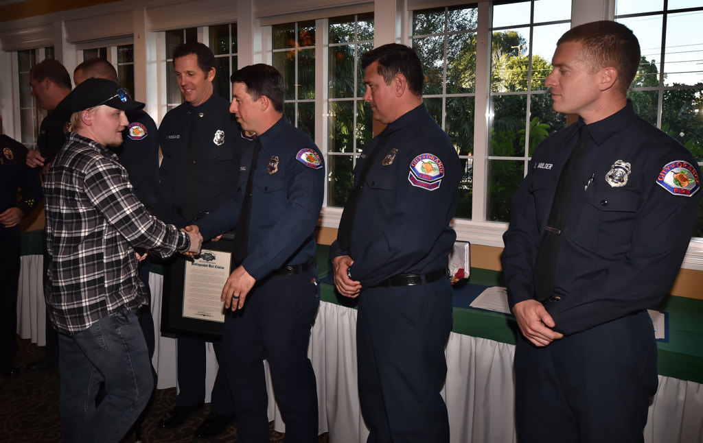 Orange PD Officer Sharif Muzayen thanks City of Orange Firefighters who helped save his life. Photo by Steven Georges/Behind the Badge OC