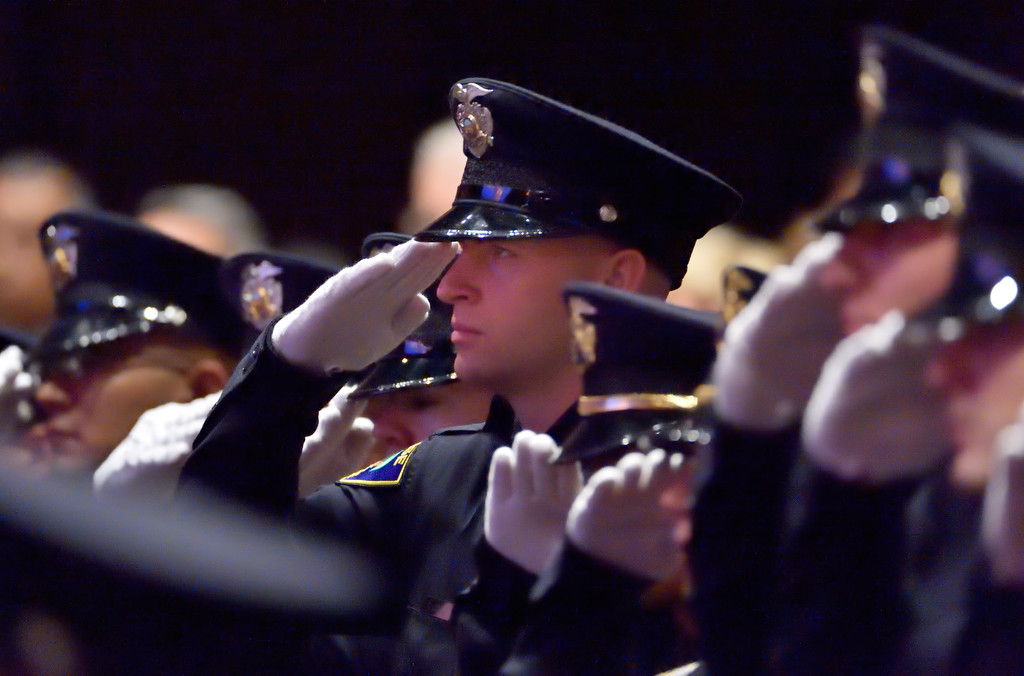 An Orange PD recruit (I think it is Greggory Cates) salutes during the Pledge of Allegiance at the start of the GWC police academy graduation ceremony. Photo by Steven Georges/Behind the Badge OC