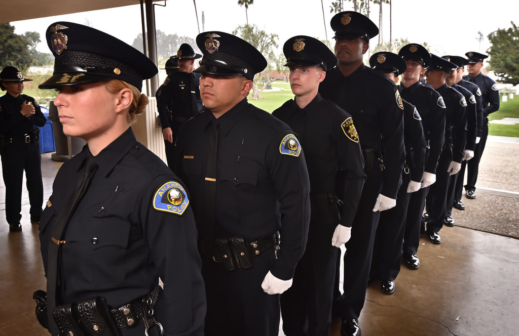 Anaheim PD recruits Ashley Hunter and Matthew Vargas get ready to enter the auditorium for the start of GWC police academy graduation ceremonies. Photo by Steven Georges/Behind the Badge OC