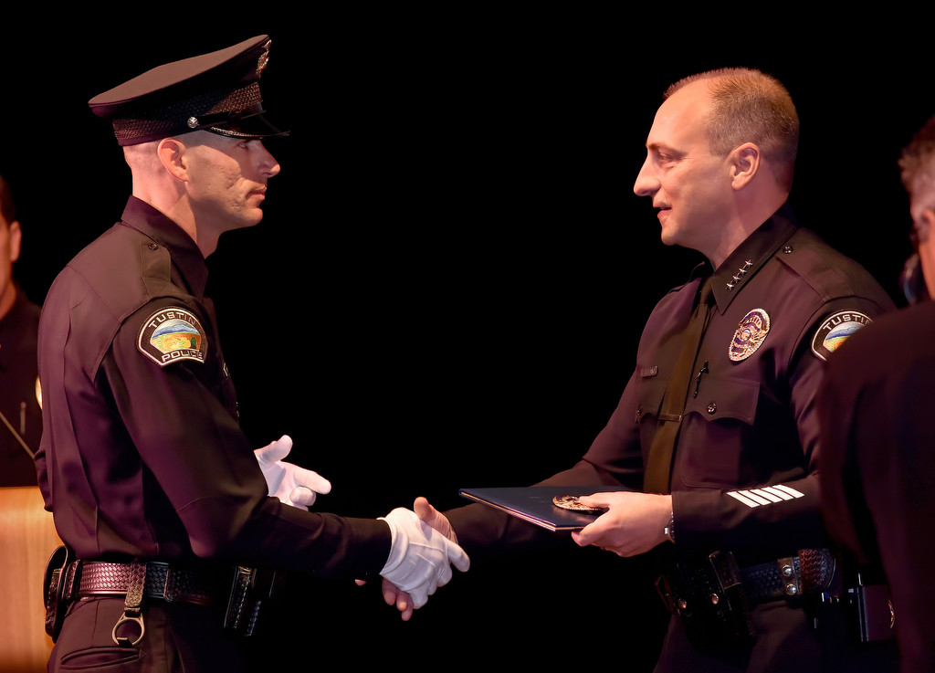 Tustin PD Recruit Zachary Swart receives his new badge from Tustin Police Chief Charles Celano during the GWC Police Academy class of 153 graduation ceremony. Photo by Steven Georges/Behind the Badge OC