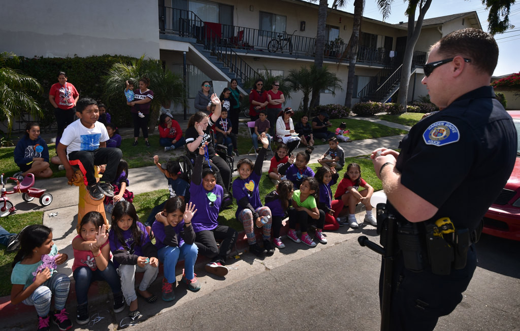 Garden Grove PD Officer Taylor Macy talks to kids about being safe during a GGPD kick-off Junior Neighborhood Watch Club event. Photo by Steven Georges/Behind the Badge OC